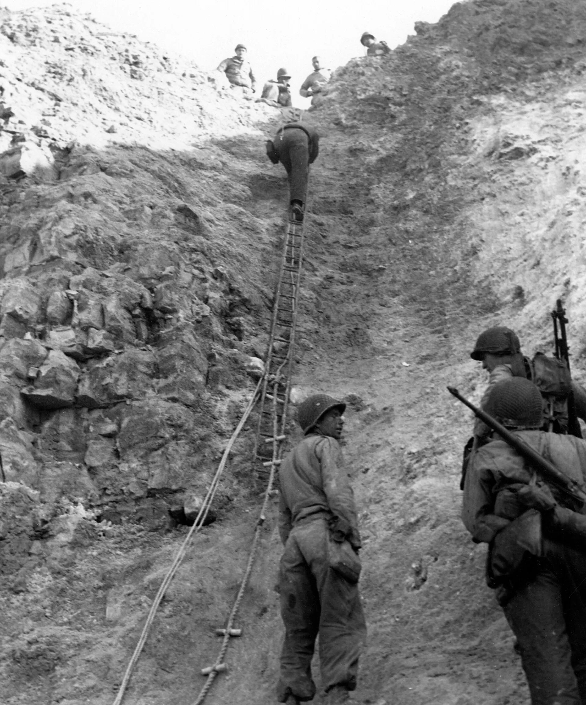 The cliffs of Pointe du Hoc in 1944, official US Navy photograph